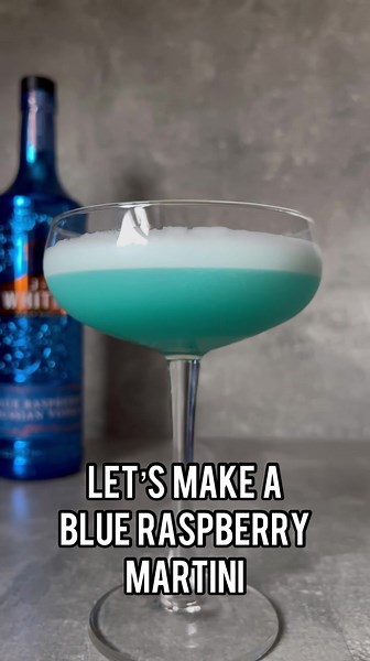 Blue Raspberry Martini #recipes #cocktails #cocktailrecipie #vodkacocktail #jjwhitley #blueraspberry