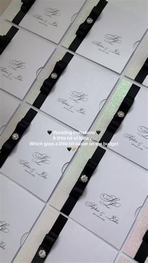 Black, White & Sparkle 🖤✨ I just love how much the wallet invitation has come back with a bang and a sure favourite for 2026 ✨ It’s simple, chic, elegant and compact. All the guest information in one neat place ✨ The options for designs are endless with these invitations too so whether it’s our classic bow style or something with a little more detail and definitely a luxury invite without breaking the bank! 🖤✨ #weddingstationery #weddinginvitation #weddinginvites #2026bride