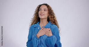 Hand on chest, woman and studio for kindness, gratitude and love or appreciation for compliment. Portrait of a happy person with gesture for thank you, empathy and peace or donation for charity