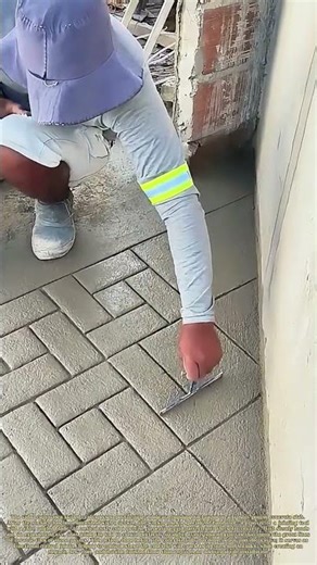 Carving the Floor: How a Hand Tool Etches a Tile Pattern into Fresh Concrete