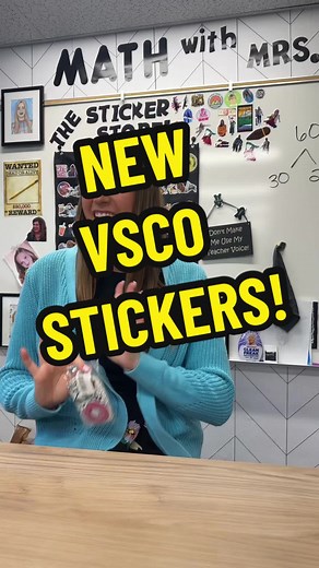 Teacher Showing New Stickers to Students