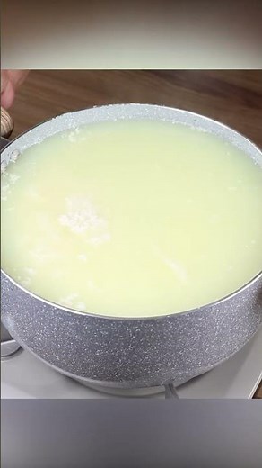 Pour the lemon into the boiling milk. Easy recipe with only 2 ingredients.