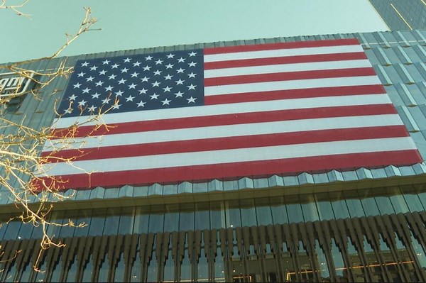 Crews unfurl massive American flag on side of new Hudson’s building in Detroit