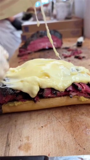 Giant sandwich at Katz's Deli It has: Pastrami, Brisket, Mustard, Melted Swiss, Coleslaw And Russian dressing On Club bread! What would you call it? What's in your sandwich???? #nycfoodie #katzdelicatessen #sandwich #pastrami #brisket