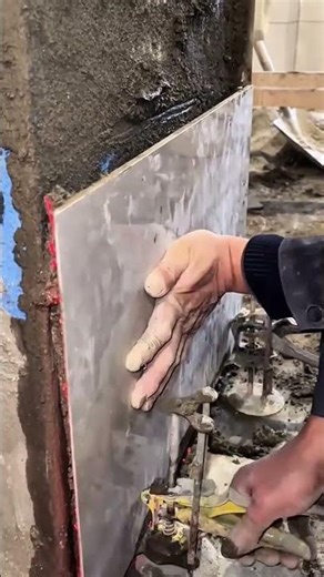 Applying metal sheet cladding to wall for reinforcement industrial construction