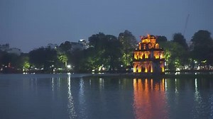 Awesome night view of the Turtle Tower in Hanoi, Vietnam