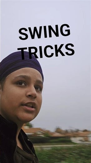 Doing random tricks on the swings at school