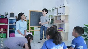(Chinese wording translation:self introduction) Educational concept of 4k Resolution. The teacher is teaching children to learn Chinese in the classroom.