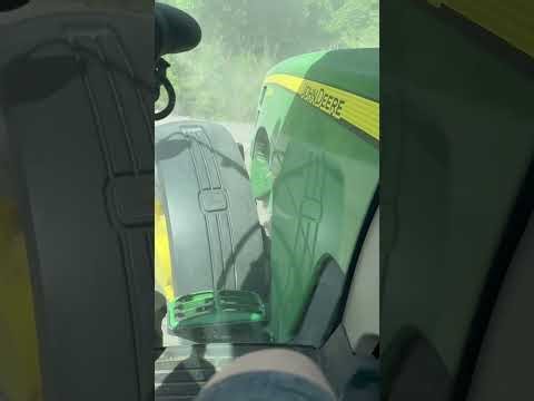 A 8225r tractor planting corn