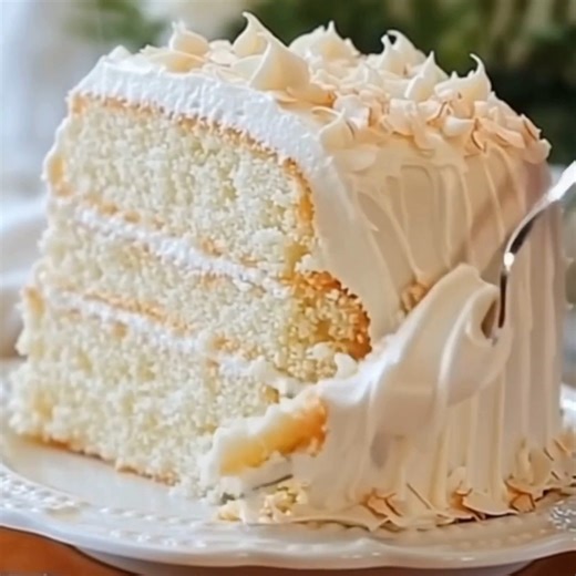 White Almond Wedding Cake with Buttercream Dreams Ingredients: 1. 2 1/2 cups all-purpose flour 2. 2 1/2 tsp baking powder 3. 1/2 tsp salt 4. 1 cup unsalted butter, softened 5. 2 cups granulated sugar 6. 5 egg whites 7. 1 tbsp almond extract 8. 1 tsp vanilla extract 9. 1 cup whole milk (room temperature) Almond Buttercream: 10. 1 cup unsalted butter, softened 11. 4 cups powdered sugar 12. 1/4 cup heavy cream 13. 1 1/2 tsp almond extract 14. 1/2 tsp vanilla extract 15. Pinch of salt Topping: 16. T