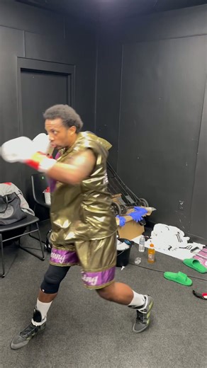 Christopher Pearson warming up with Nate Jones on pads