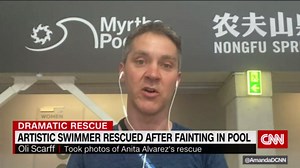 Photographer recalls moment swim coach saved swimmer who fainted underwater