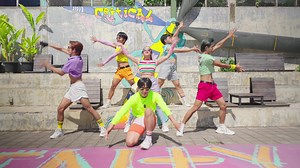 Group of dancers in colorful outfits performing outdoors