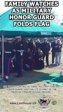 Family watches as Military Funeral Honor Guard folds flag
