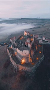 The medieval 14th century Citadel Rupea or Rupea Fortress in Romania. It was constructed by Transylvanian Saxons in the Kingdom of Hungary. Situated on a high rock, some 70 km from the town of Brasov, it had a key strategic role as the fortress was the key link between Transylvania, Moldavia and Wallachia. Video by: @ibdansch | Beautiful Houses and Buildings