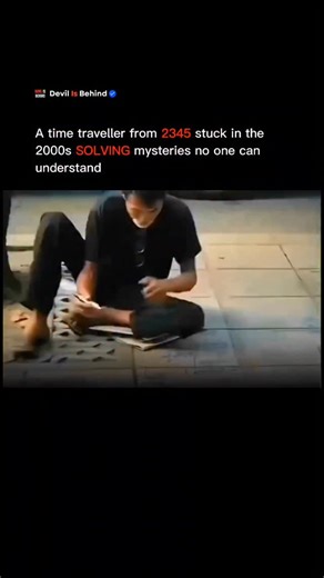 Devil Is Behind on Instagram: "He is not from our time. Stuck in the early 2000s, this man claims to be a time traveler from the year 2345. For the past 18 years, he has been wandering the streets, quietly observing the world around him—forests, alleys, and empty streets-leaving a trail of chalk and numbers wherever he goes. Everywhere he goes, blackboards appear. Trees become his canvas. Pavements turn into math puzzles. Complex equations, formulas, and calculations that would baffle even the b