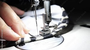 Sewing machine stitching of clothes close up, macro. Slow motion frame of thread and needle. Textile fabric. Stock Video