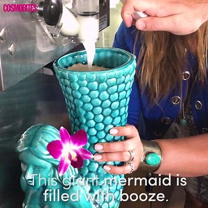 This giant mermaid cocktail contains 114 ounces of frozen margarita and sangria 😱✨🍹. Here's where to find it: http://bit.ly/2rwA06c | Cosmopolitan