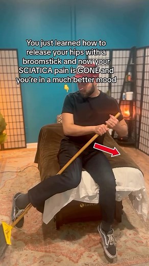 RELIEVE SCIATICA with a BROOMSTICK This puts the hips into internal and external rotation for a stretch which can help relax the glutes/ hips/ piriformis muscle! This helps take pressure off the sciatic never which helps relieve SCIATICA! FOLLOW TO RELAX YOUR BODY! #trending #viral This is not medical advice | Moore Wellness