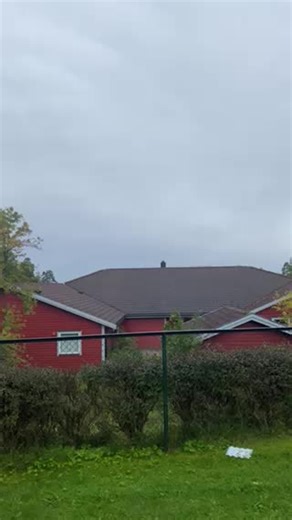 Yellow Helicopter Over Rural Red House