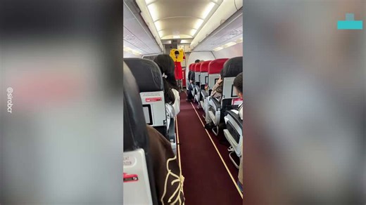 AirAsia Crew Member Takes a Hard Fall During Safety Demo