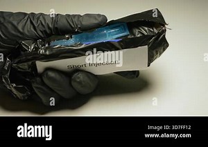 Harm Reduction kit provided by government program for safe consumption of drugs. Short Injection package contain needles, sterile water cooker and more: Toronto, Ontario, Canada - November 12, 2025