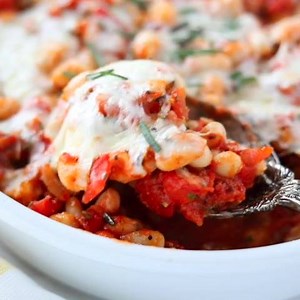 A quick trip to the pantry is all you need to put an Italian spin on this CHEESY ITALIAN BAKED CANNELINI BEANS recipe. Add your favorite cheese and herbs! full recipe >> https://reluctantentertainer.com/cheesy-italian-baked-cannelini-beans/ | Reluctant Entertainer