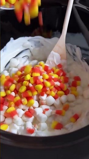 These candy corn popcorn balls combine a perfect blend of sweet and salty in every bite, making them