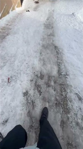 Man slips and tumbles on icy pathway in Makhachkala, Russia