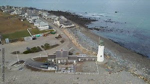 Scituate Lighthouse - Massachusetts - An orbital aerial shot around a lighthouse in New England.