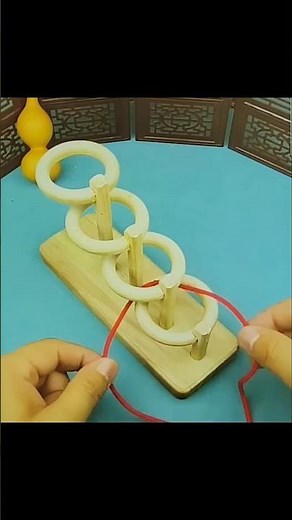 How to solve 4 rings and string puzzle