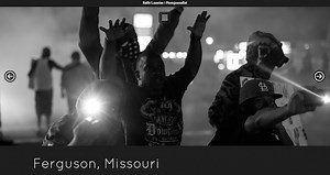 Ferguson Cop Pulls Gun On Photographer Who Was Asking Directions to the Media Area