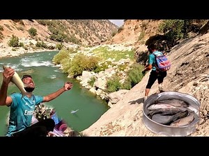 Fantastic Atabek fishing from the roaring river: family happiness