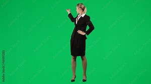 Footage of a businesswoman showing something behind her