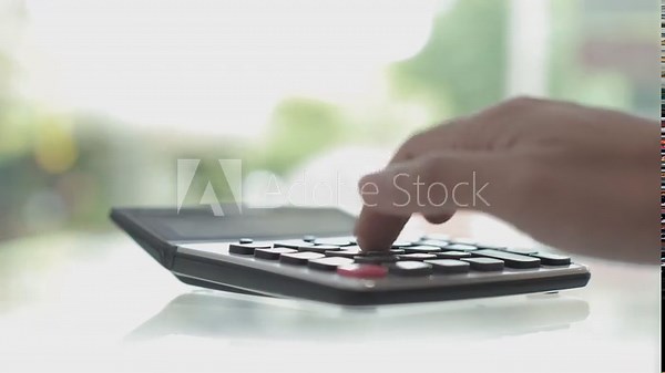 hand holding calculator, Manual calculator Financial calculations with a calculator Close-up of a finger-press calculator