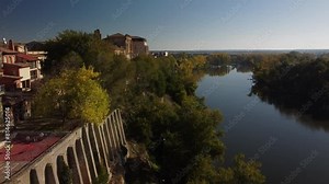 A drone view of the Duero river as it passes through Tordesillas-Spain, next to the convent of Santa Clara.