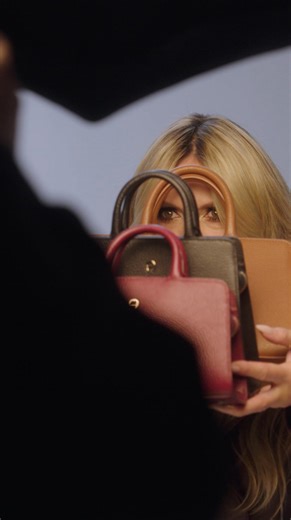 Come behind the scenes with Heidi Klum in Los Angeles, as she brings unstoppable energy and elegance to the set and the AIGNER Fall/Winter 2025 campaign. Discover the first styles in store and online. | AIGNER