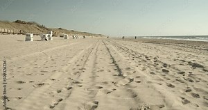 Beach of Sylt, wide shot, dunes and northsea in the background, dünen strand und meer 4k 60fps