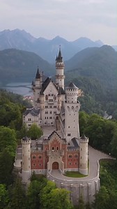 Neuschwanstein Castle, a famous castle located in Bavaria, Germany. This castle was built in the 19th century under the direction of King Ludwig II of Bavaria and is one of the most prominent examples of romantic architecture in the world. The castle is situated on a rugged hill, surrounded by the majestic Alps and lush green forests, creating a fairy-tale-like scenery. Neuschwanstein features pointed towers, white stone walls, and steep roofs, embodying a strong medieval style. The interior is 