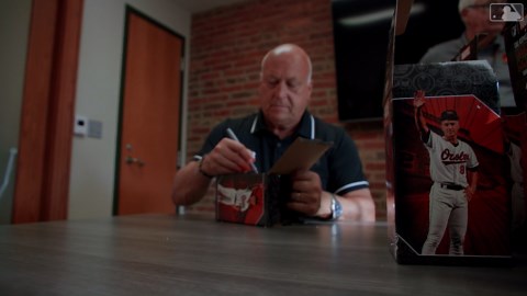 Cal Ripken Jr. signs Iron Man bobbleheads