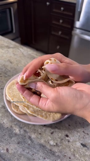 If you’ve never made tortillas at home, this is where you start. This flour tortilla recipe uses simple pantry staples and comes together in about 30 minutes. The hot water makes the dough easy to roll thin, and cooking them in a skillet gives you those classic brown spots and soft pockets of air. These homemade flour tortillas stay flexible, don’t crack when folded, and taste fresh in a way store bought never does. I BETTER NOT CATCH YOU buying packaged tortillas once you realize how EASY this 