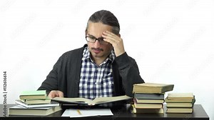 man sitting at table studying hard. 4k people stock footage clip at white background.