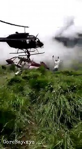 Man sliced by a helicopter in a rescue attempt - SeeGore