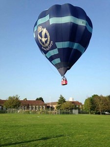 TEAM EAGLE! The Army Air Corps' hot air balloon has taken to the skies once again this Summer under the aegis of HQ AAC Head of Recruiting Mr David Gell. Since its first flight in May, pictured below gliding over the rooftops of houses at Middle Wallop, Hampshire the balloon has been flown both tethered and untethered at numerous charitable and ballooning events across England, broadcasting the name of the AAC and bringing pleasure to many. | Army Air Corps