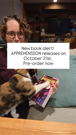 I support Elsie by being a science fiction writer. Do I enjoy writing for itself? Yes. But let's be clear that my role in life is to support this tiny cat. And if you want to help me do that, you can pre-order this book APPREHENSION by @maryrobinettekowal and RED STAR HUSTLE @sam.j.miller from @sagapressbooks APPREHENSION is basically Hitchcock in space. A 78 year old grandmother goes on a vacation with her family on another planet and her past as a special ops, soldier comes back in unexpected 