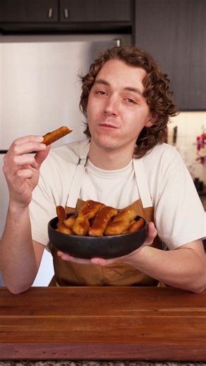 Chef Tyler on Instagram: "You can make these pretzels for less than $4. - Ingredients: - 1 ball of storebought pizza dough - 3/4 cup baking soda - 4 tbsp Butter - Flaky salt for sprinkling - Instructions: Start with one ball of pizza dough, which you can buy from most grocery stores for $3. Stretch it out so it's relatively flat and rectangular, and cut it into whatever shape you want. I'm keeping it simple with some strips. Then add three quarters of a cup of baking soda to about ten cups of wa