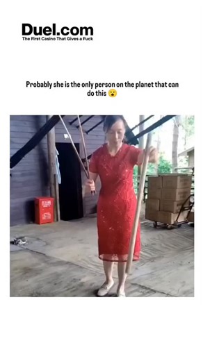 mindvlo_ing on Instagram: "The video captures an Asian woman in a red dress expertly juggling devil sticks—a 1990s toy involving two control sticks to spin and manipulate a longer central baton—in a rustic warehouse, executing fluid tosses and rotations over 35 seconds. Posted October 26, 2025, by @PicturesFoIder , an account curating global viral clips, it exploded to 3+ million views by highlighting her poise, though the caption's "only person on the planet" claim drives engagement through hyp
