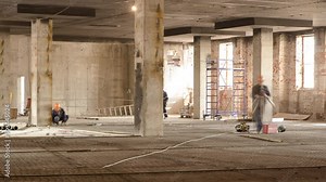 Construction workers with scaffolding and tools inside the floor of high rising building timelapse, skyscraper. Building under construction. Interior work in progress.