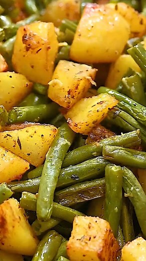 These Roasted Potatoes and Green Beans are so easy and delicious. Made with just a few simple ingredients, this quick dish makes a flavorful side or light meal that you're going to just love! #veganrecipes #potatorecipes #easyvegan #vegancomfortfood #quickveganmeal #food | Eat Something Vegan