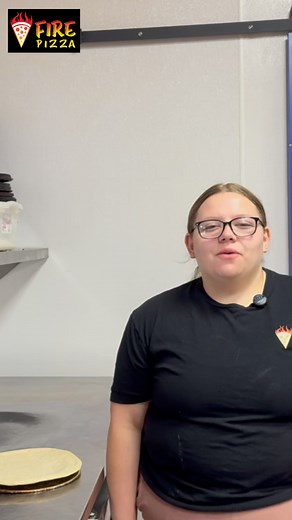 Kayleigh at Fire Pizza Flora making the Southwest Chicken pizza of the month for June! Stop by and tell us what you think! | Fire Pizza Flora